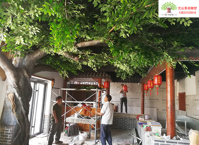 饭店里制作一棵假树一座假山流水增添了完美